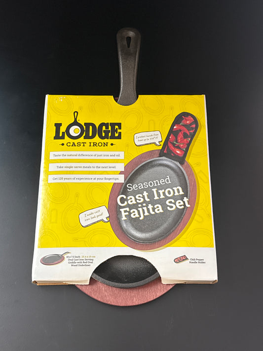 Lodge LFSR3 10" x 7 1/2" Oval Pre-Seasoned Cast Iron Fajita Skillet with Red Wood Underliner and Chili Pepper Handle Holder