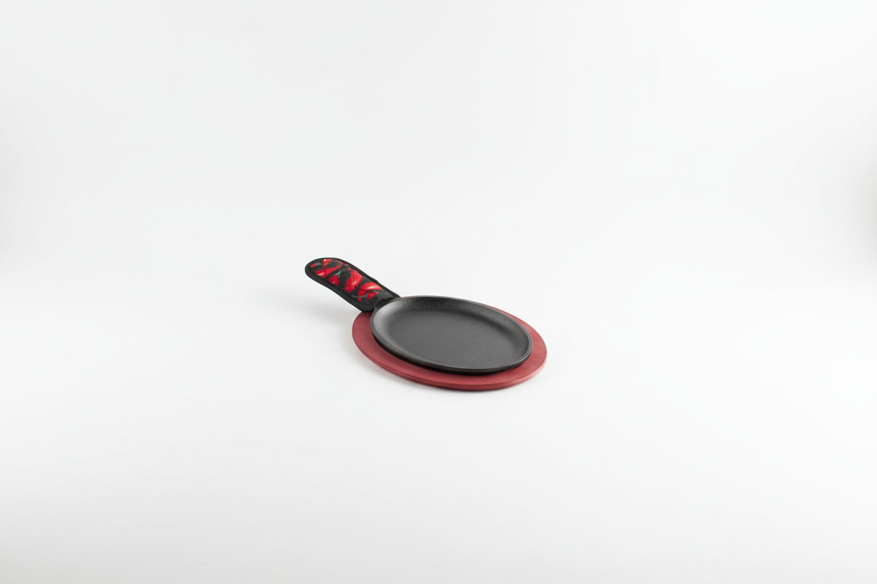Lodge LFSR3 10" x 7 1/2" Oval Pre-Seasoned Cast Iron Fajita Skillet with Red Wood Underliner and Chili Pepper Handle Holder